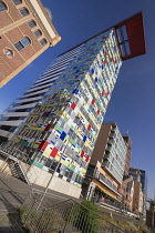 Germany, North Rhine-Westphalia, Dusseldorf, MedienHafen or Media Harbour area, The Colorium Building designed by British architect Will Alsop and standing 17 stories tall along the Rhine, catches the...