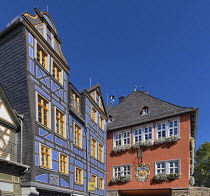 Germany, Hesse, Idstein, Rathaus or Town Hall with the colourful timber frame Blaues Haus or Blue House alongside.