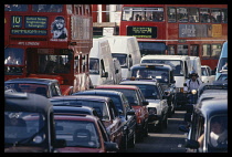 England; London, Traffic jam with cars, taxi cabs and buses.