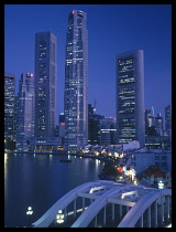 Singapore, Singapore City, Boat Quay at night with Elgin Bridge  Raffles Place skyline behind .